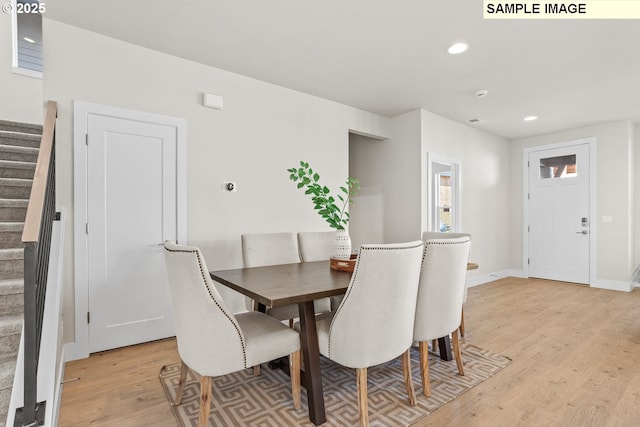 8276 SE Orion Ln, Hillsboro, OR 97123 - dining area with stairs, light wood finished floors, recessed lighting, and baseboards