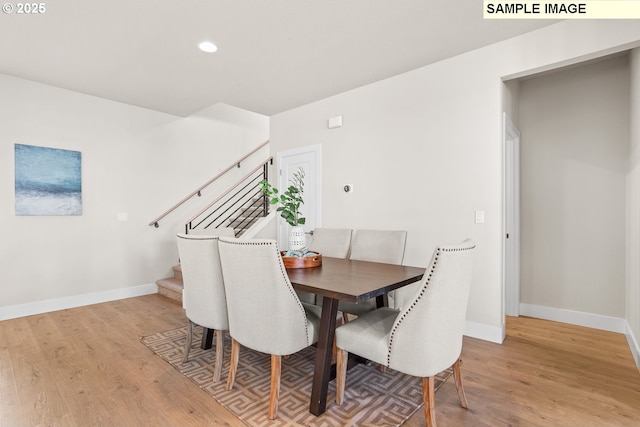 8276 SE Orion Ln, Hillsboro, OR 97123 - dining space with light wood finished floors, baseboards, stairs, and recessed lighting