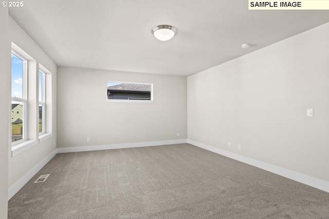 8276 SE Orion Ln, Hillsboro, OR 97123 - spare room with carpet and baseboards