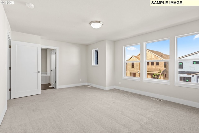 8276 SE Orion Ln, Hillsboro, OR 97123 - carpeted empty room with plenty of natural light, baseboards, and a smoke detector