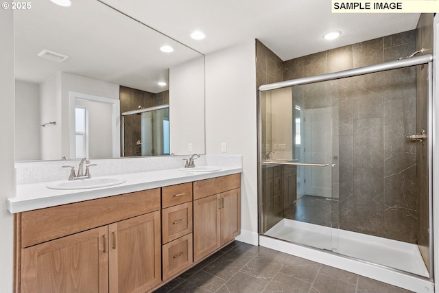 8276 SE Orion Ln, Hillsboro, OR 97123 - bathroom featuring a shower stall, double vanity, and recessed lighting
