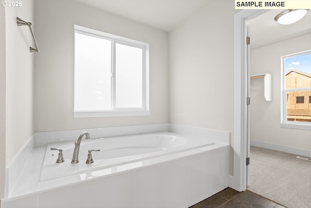 8276 SE Orion Ln, Hillsboro, OR 97123 - bathroom featuring a garden tub and baseboards