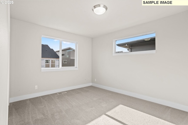 8276 SE Orion Ln, Hillsboro, OR 97123 - carpeted spare room featuring baseboards