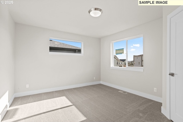 8276 SE Orion Ln, Hillsboro, OR 97123 - empty room featuring carpet floors and baseboards