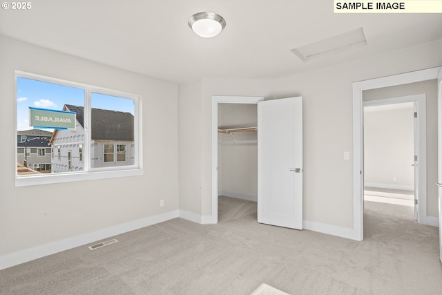 8276 SE Orion Ln, Hillsboro, OR 97123 - unfurnished bedroom with attic access, carpet floors, baseboards, and a closet