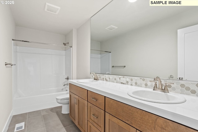 8276 SE Orion Ln, Hillsboro, OR 97123 - bathroom with double vanity, toilet, tile patterned flooring,  shower combination, and baseboards