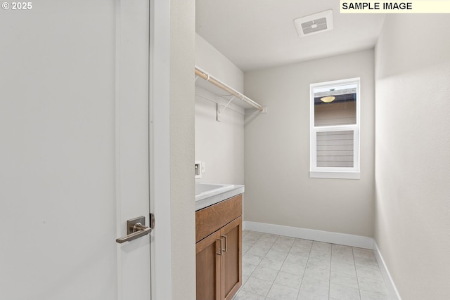 8276 SE Orion Ln, Hillsboro, OR 97123 - laundry room featuring baseboards