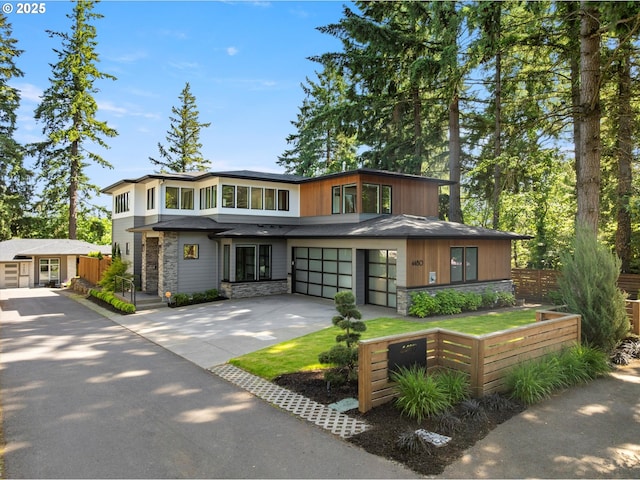 4480 Upper Dr, Lake Oswego, OR 97035 - view of front facade with stone siding, a garage, and driveway