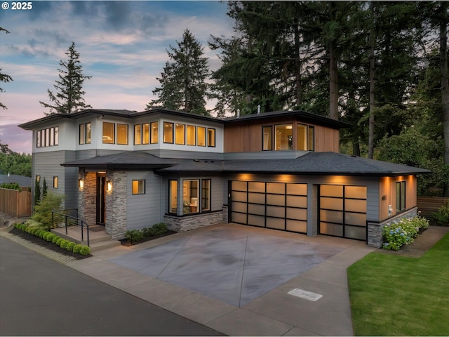 4480 Upper Dr, Lake Oswego, OR 97035 - view of front facade featuring stone siding, driveway, and a garage