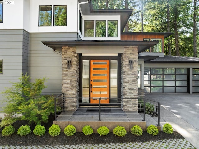 4480 Upper Dr, Lake Oswego, OR 97035 - doorway to property with concrete driveway and stone siding