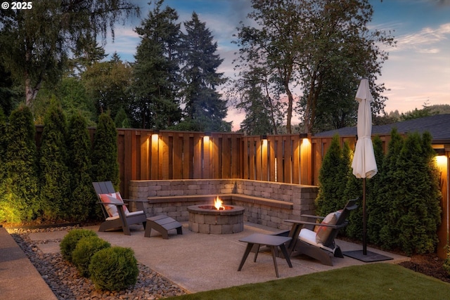 4480 Upper Dr, Lake Oswego, OR 97035 - patio terrace at dusk featuring an outdoor fire pit, a patio, and a fenced backyard