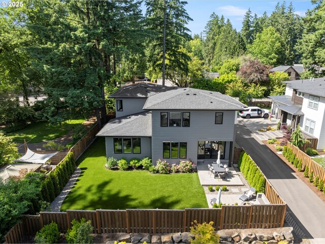 4480 Upper Dr, Lake Oswego, OR 97035 - back of house with a fenced backyard, a patio, and a shingled roof