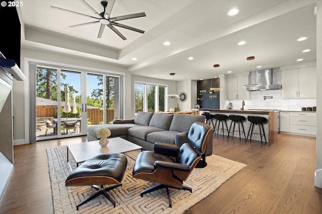 4480 Upper Dr, Lake Oswego, OR 97035 - living room featuring light wood-style floors, recessed lighting, a ceiling fan, and a raised ceiling