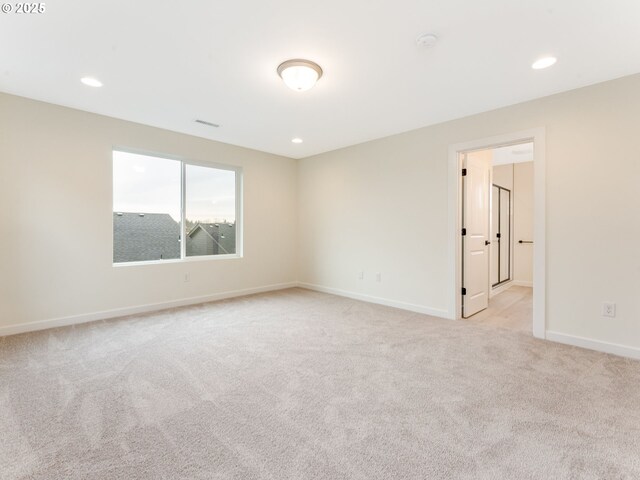 unfurnished room featuring visible vents, baseboards, recessed lighting, and light colored carpet