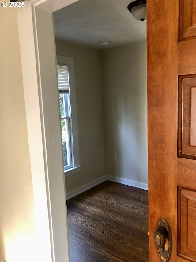 3929 SE 65th Ave, Portland, OR 97206 - empty room with dark wood-type flooring and baseboards