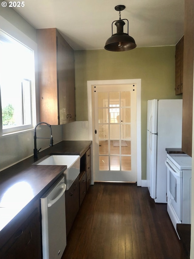 3929 SE 65th Ave, Portland, OR 97206 - kitchen with electric range, dishwasher, dark countertops, dark wood-style floors, and pendant lighting