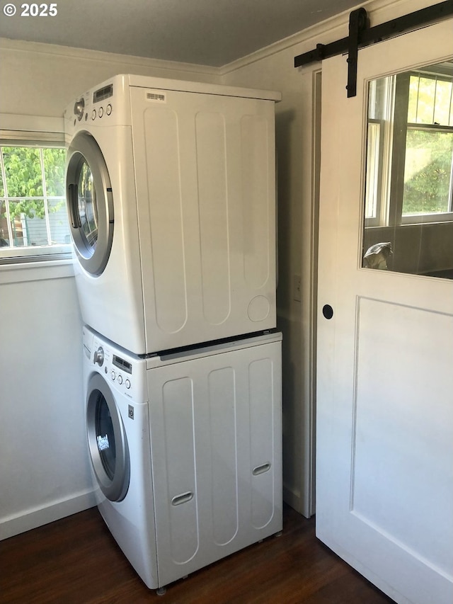 3929 SE 65th Ave, Portland, OR 97206 - washroom featuring stacked washer / dryer, dark wood-type flooring, healthy amount of natural light, and ornamental molding