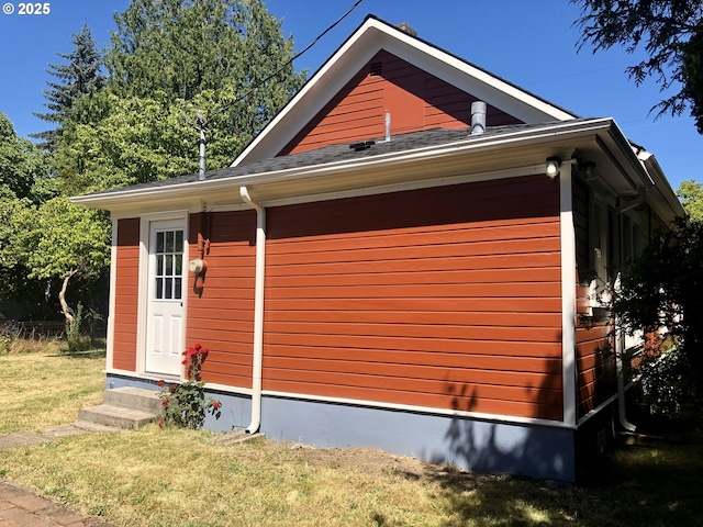 3929 SE 65th Ave, Portland, OR 97206 - view of property exterior with entry steps and a yard