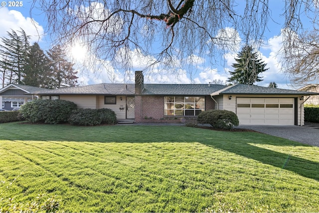 single story home with brick siding, a front lawn, an attached garage, and driveway