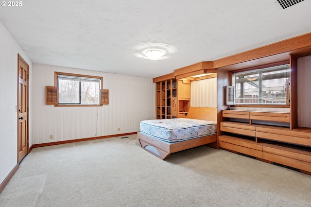 bedroom featuring carpet flooring, visible vents, and baseboards