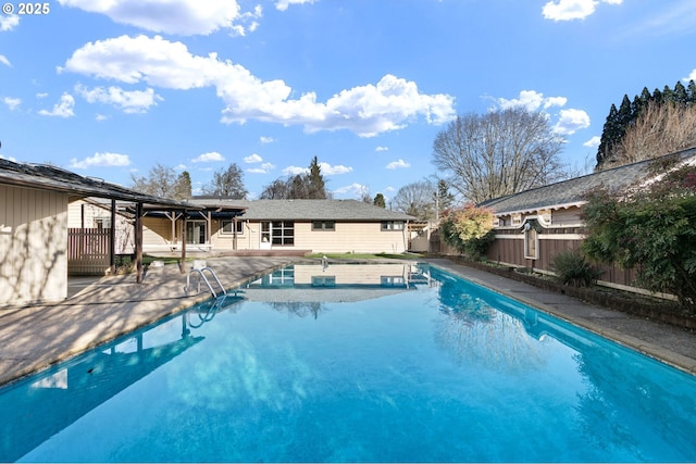 view of swimming pool featuring a patio area, a fenced in pool, and a fenced backyard