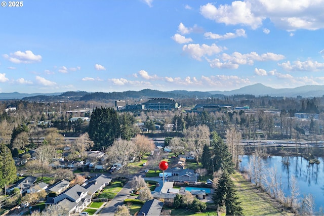 birds eye view of property featuring a water and mountain view