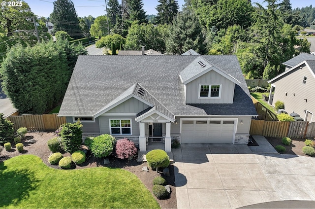 14206 SE Woodside Ave, Milwaukie, OR 97267 - view of front of property featuring driveway, a shingled roof, stone siding, and board and batten siding