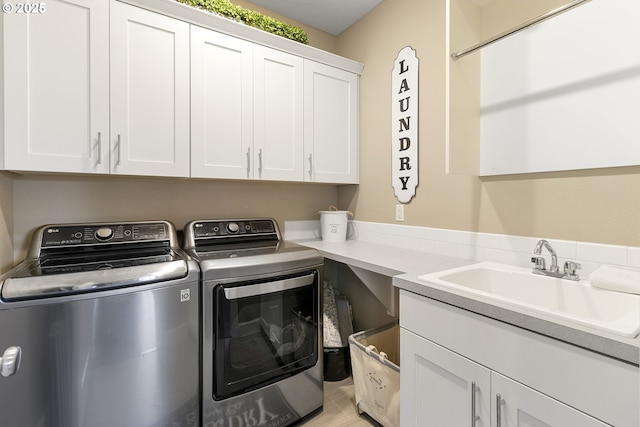 14206 SE Woodside Ave, Milwaukie, OR 97267 - laundry room featuring cabinet space and washer and clothes dryer