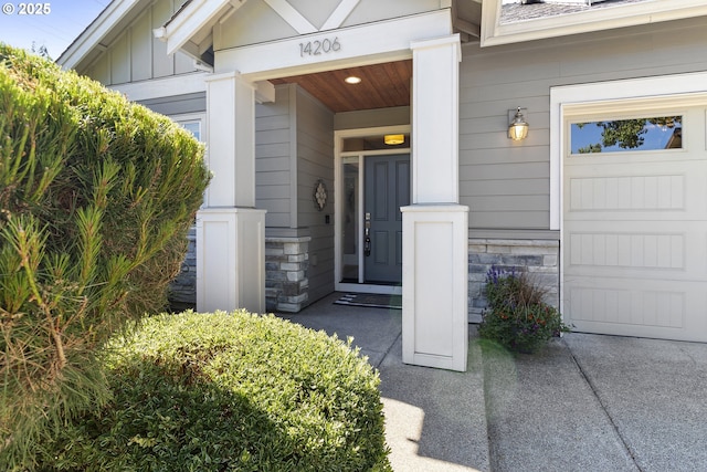 14206 SE Woodside Ave, Milwaukie, OR 97267 - property entrance featuring board and batten siding, stone siding, and covered porch