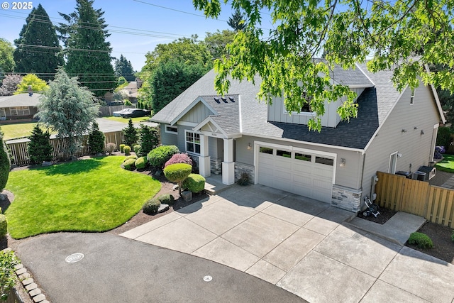 14206 SE Woodside Ave, Milwaukie, OR 97267 - view of front of house featuring board and batten siding, driveway, stone siding, a shingled roof, and a garage