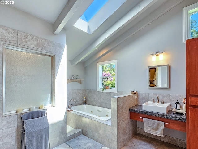 10059 SW 57th Pl, Portland, OR 97219 - full bathroom featuring tile patterned floors, a tub with jets, healthy amount of natural light, and a skylight
