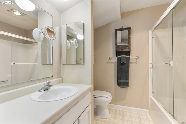 bathroom with baseboards, toilet, tile patterned floors, combined bath / shower with glass door, and vanity