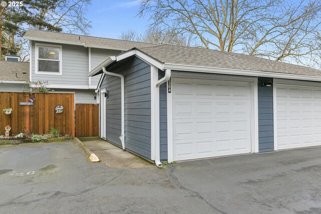 garage with fence