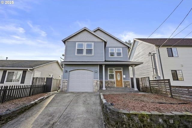 view of front of property with a garage and covered porch