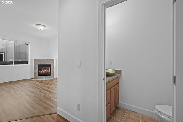 bathroom featuring toilet and vanity