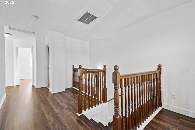 hallway featuring dark wood-type flooring