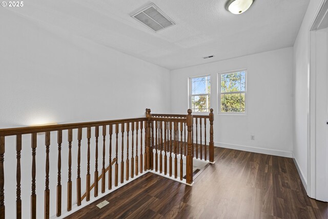 hallway featuring dark hardwood / wood-style floors