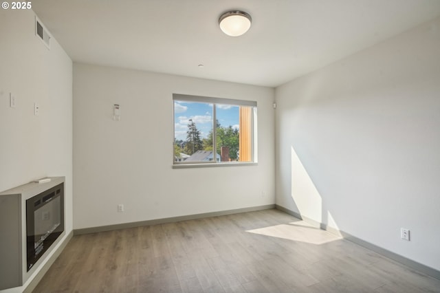 unfurnished living room featuring light hardwood / wood-style floors