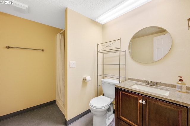 full bathroom with baseboards, toilet, vanity, and a textured ceiling