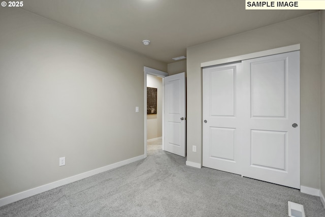 17407 SW Atfalati Ln Unit 45, Sherwood, OR 97140 - unfurnished bedroom with baseboards, carpet, and a closet