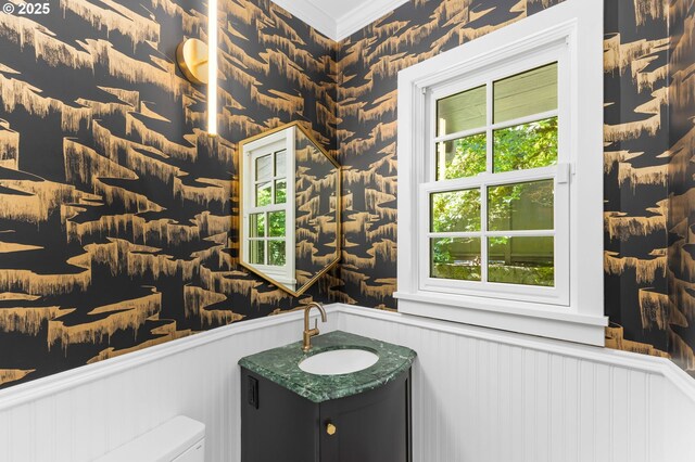 3925 SW Humphrey Blvd, Portland, OR 97221 - bathroom with a wainscoted wall, ornamental molding, vanity, and a decorative wall