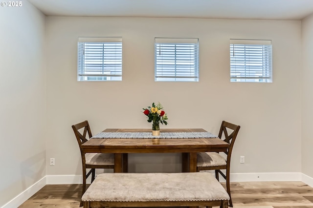4451 SE Hardwood Ln, Hillsboro, OR 97123 - dining space featuring wood finished floors and baseboards