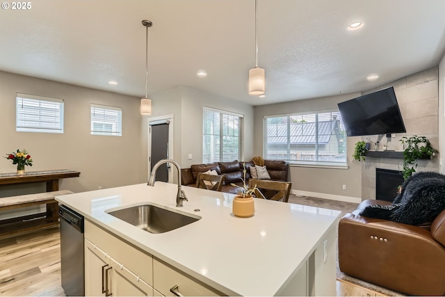 4451 SE Hardwood Ln, Hillsboro, OR 97123 - kitchen with a sink, open floor plan, dishwasher, healthy amount of natural light, and recessed lighting