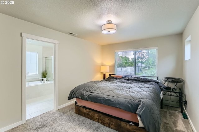 4451 SE Hardwood Ln, Hillsboro, OR 97123 - bedroom with carpet, baseboards, ensuite bathroom, and a textured ceiling