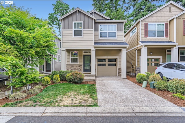 4451 SE Hardwood Ln, Hillsboro, OR 97123 - craftsman-style home featuring board and batten siding, stone siding, a garage, and concrete driveway