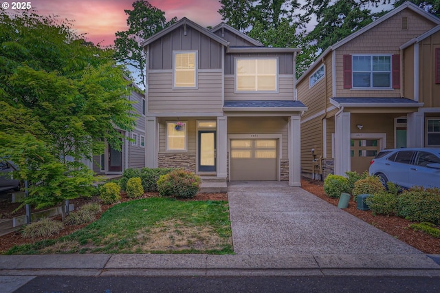 4451 SE Hardwood Ln, Hillsboro, OR 97123 - craftsman-style house featuring board and batten siding, a garage, driveway, and stone siding