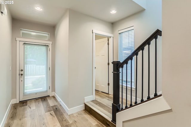 4451 SE Hardwood Ln, Hillsboro, OR 97123 - entrance foyer with light wood-type flooring, stairs, baseboards, and recessed lighting