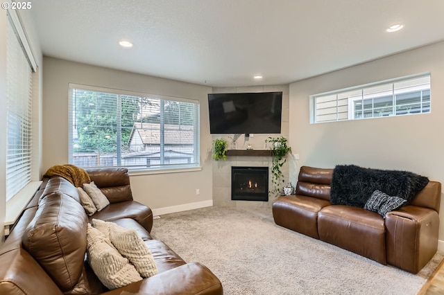 4451 SE Hardwood Ln, Hillsboro, OR 97123 - living area featuring baseboards, recessed lighting, a fireplace, and carpet flooring
