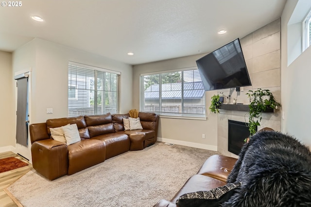 4451 SE Hardwood Ln, Hillsboro, OR 97123 - living area featuring baseboards, recessed lighting, and a tiled fireplace