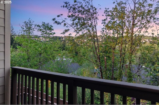 view of balcony at dusk